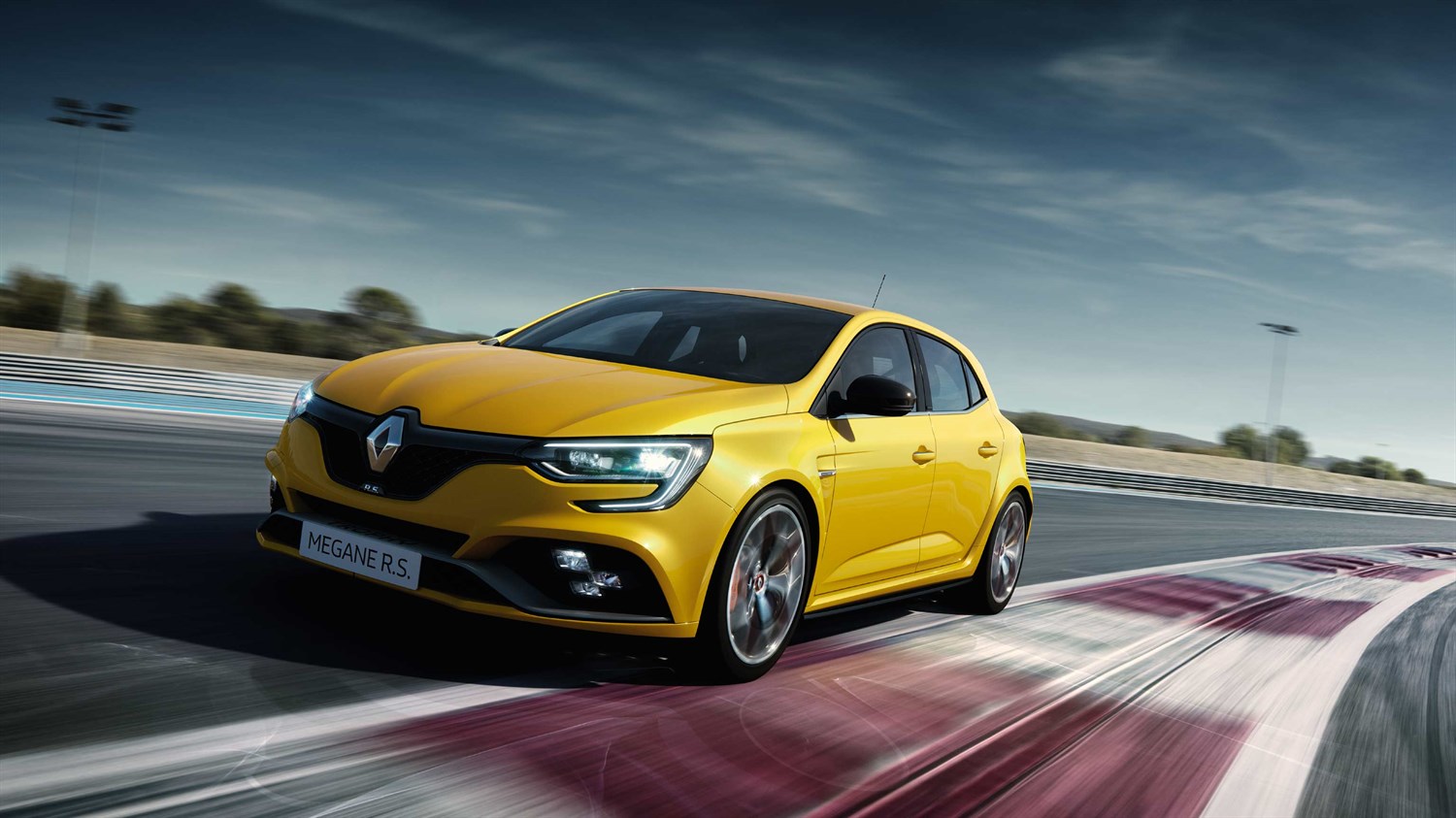 Yellow colored Renault MEGANE R.S. Trophy during the runtime on a track