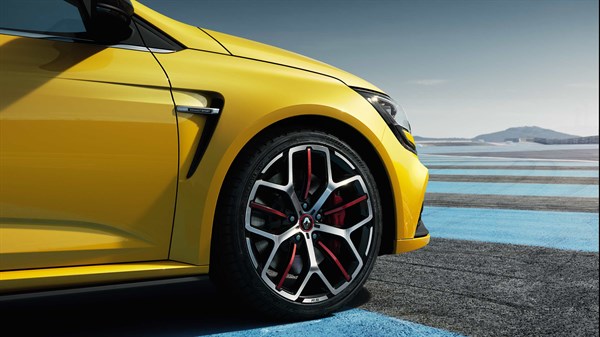 A yellow-colored Renault MEGANE's front alloy wheel