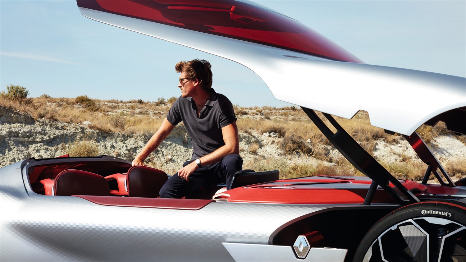 A man sitting on the Renault TREZOR concept car